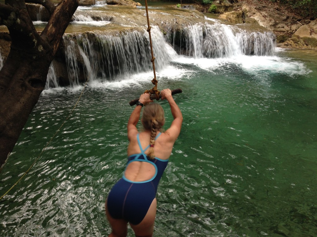 Janet flies on the rope swing into the cascade