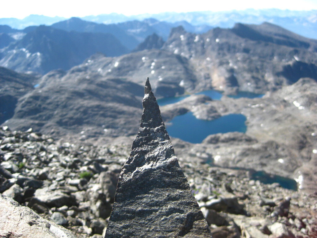 All the unnamed peaks to the South with a triangle rock in foreground.