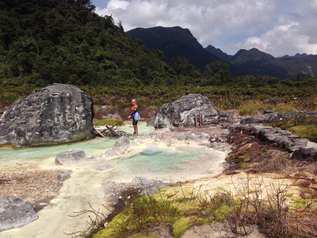 Janet crossing a bridge at Termales San Juan