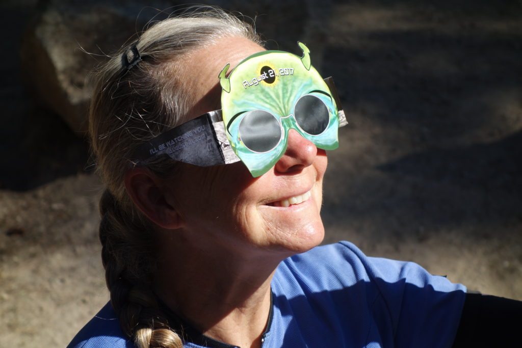 Janet wearing the eclipse glasses that Stan got for our group. I didn't realize it beforehand, but this type of lens was crucial for our enjoyment of the eclipse.